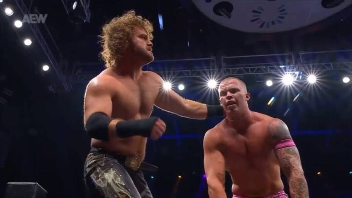 Hangman Adam Page celebrating his victory over Kyle Fletcher at AEW All Out 2025.